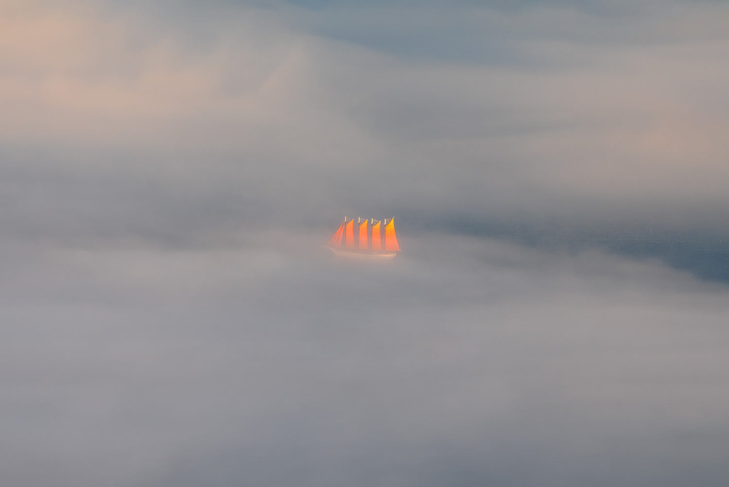 Red sails at sunset in the clouds, photographed by Ararat Agayan